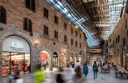 A view of outlet village with people exploring