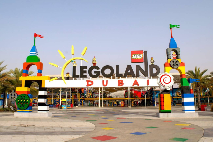 A photo of the Legoland waterpark entrance in Dubai. The entrance is a large, colorful archway with the Legoland logo in the center.